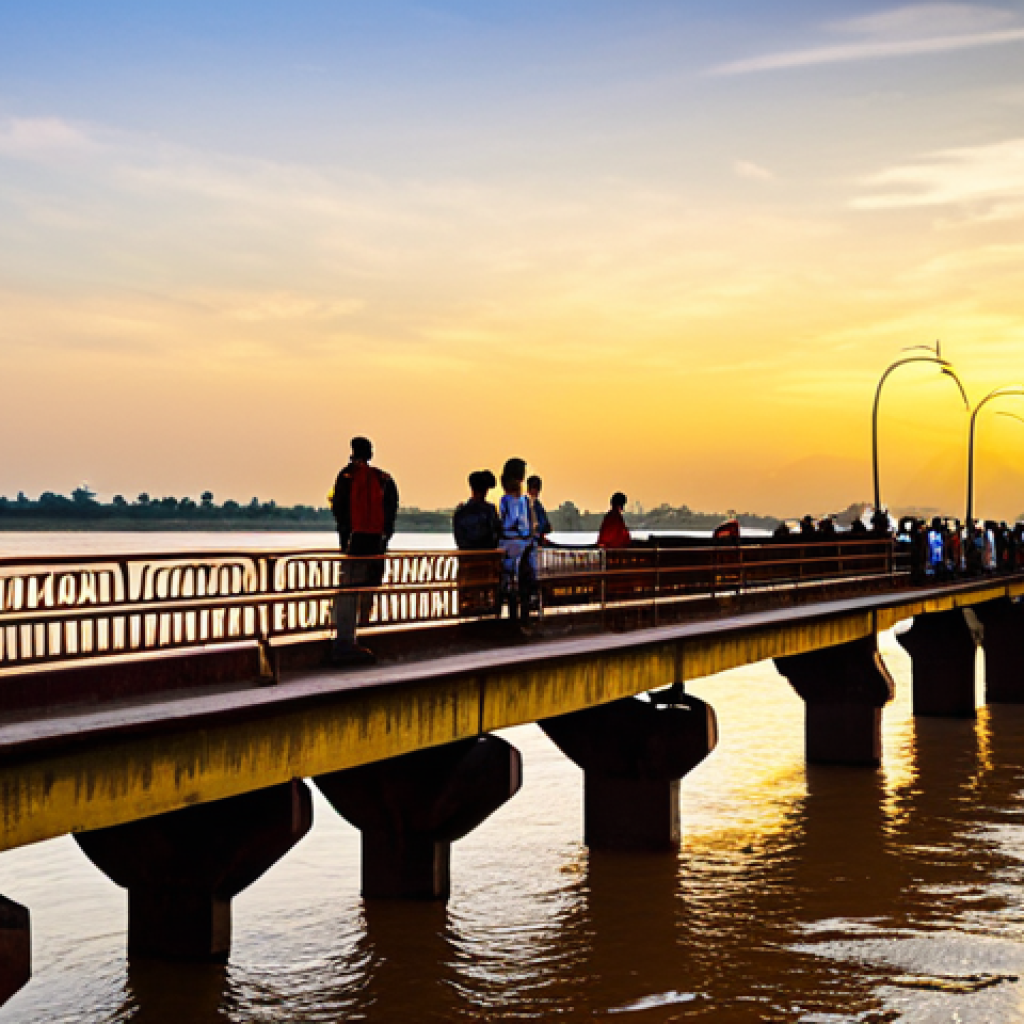 **

"A scenic view of the Pakse Bridge over the Mekong River at sunset, fully clothed tourists are admiring the golden water. Safe for work, appropriate content, professional photography, natural proportions, high quality, family-friendly. Include modest attire."

**